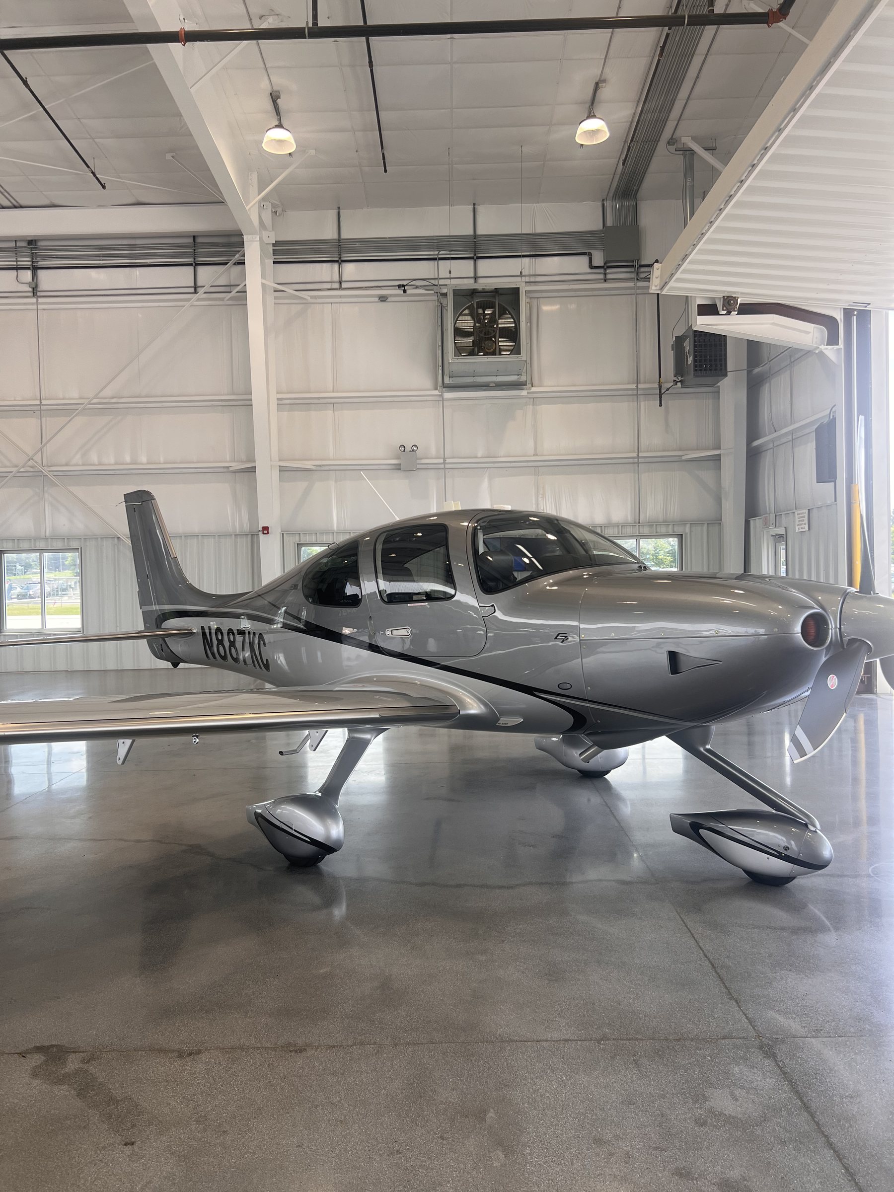 2025 Cirrus SR22 G7+ N887KC side profile in the hangar